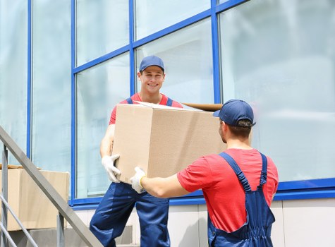 People moving items into a Longford storage facility